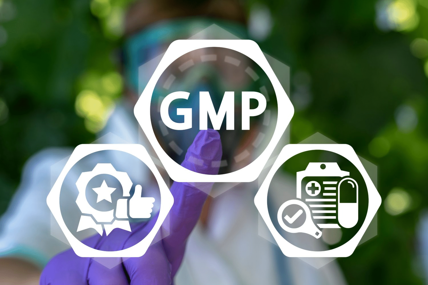 A person wearing protective gloves and goggles presses a transparent button display with "GMP" in the center, surrounded by icons of quality approval and a medical clipboard. The background is blurred greenery, hinting at the utilization of advanced gummy manufacturing equipment.