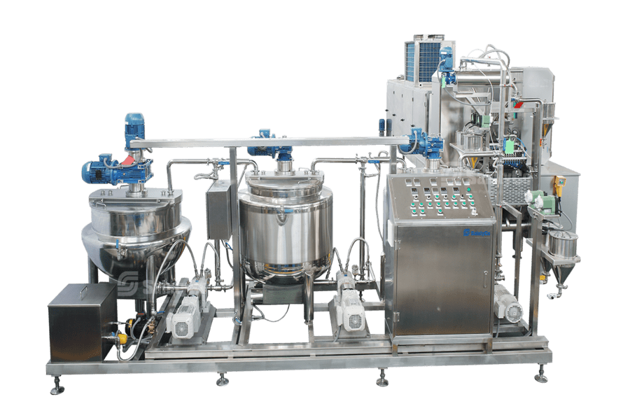 A stainless steel gummy making machine used for food processing, the Gummygenix features multiple tanks, valves, pipelines, and electronic control panels with buttons and indicators. The setup is mounted on a metal frame with motors and other components attached.