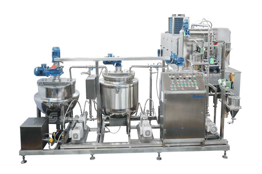 A stainless steel gummy making machine used for food processing, the Gummygenix features multiple tanks, valves, pipelines, and electronic control panels with buttons and indicators. The setup is mounted on a metal frame with motors and other components attached.
