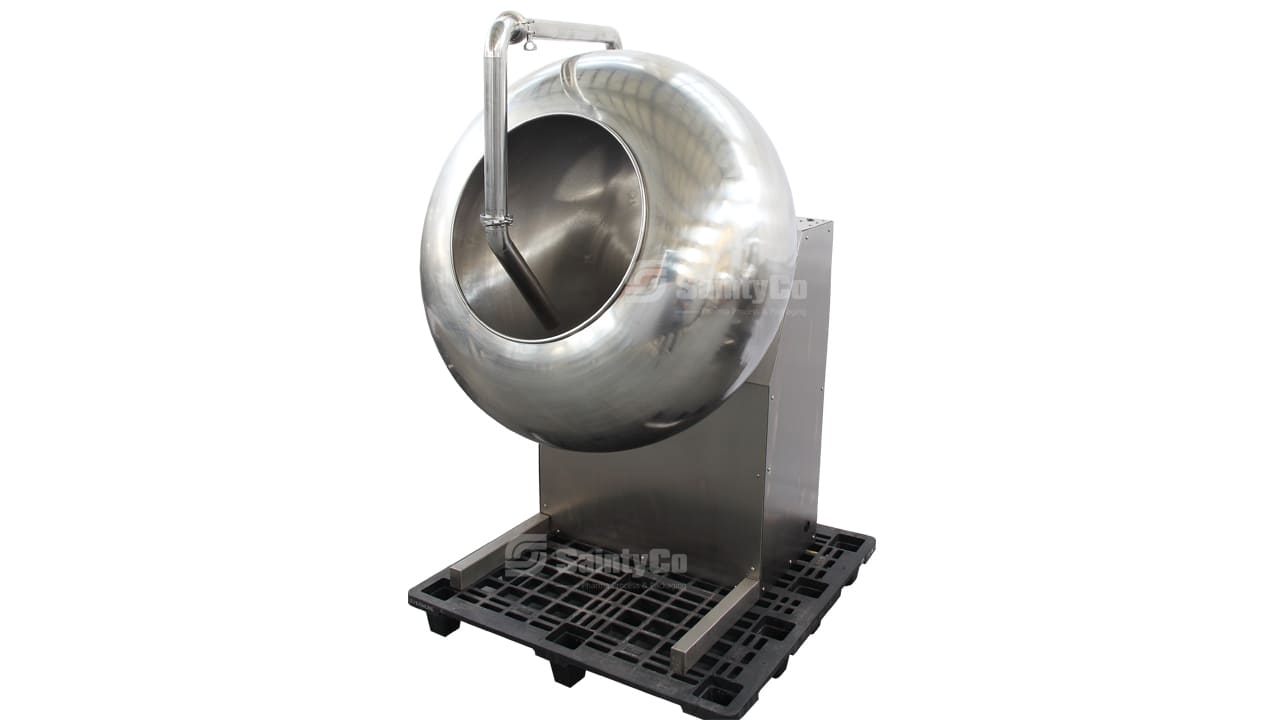 A large, stainless steel coating machine with a spherical drum and a spout, mounted on a sturdy, black, grid-patterned base. The machine is isolated on a white background, showcasing its polished metal structure and industrial design—perfect for gummy manufacturing equipment by SaintyCo.