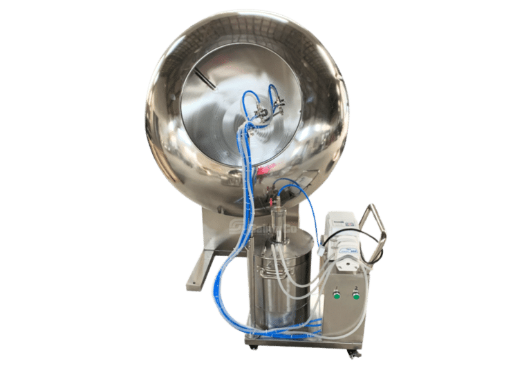 Large, shiny stainless-steel machine with a round, open drum and multiple blue hoses attached. The device, likely a SaintyCo gummy making machine, is mounted on a metal frame with wheels and features a control panel with various buttons. Ideal for industrial processes such as mixing or coating.