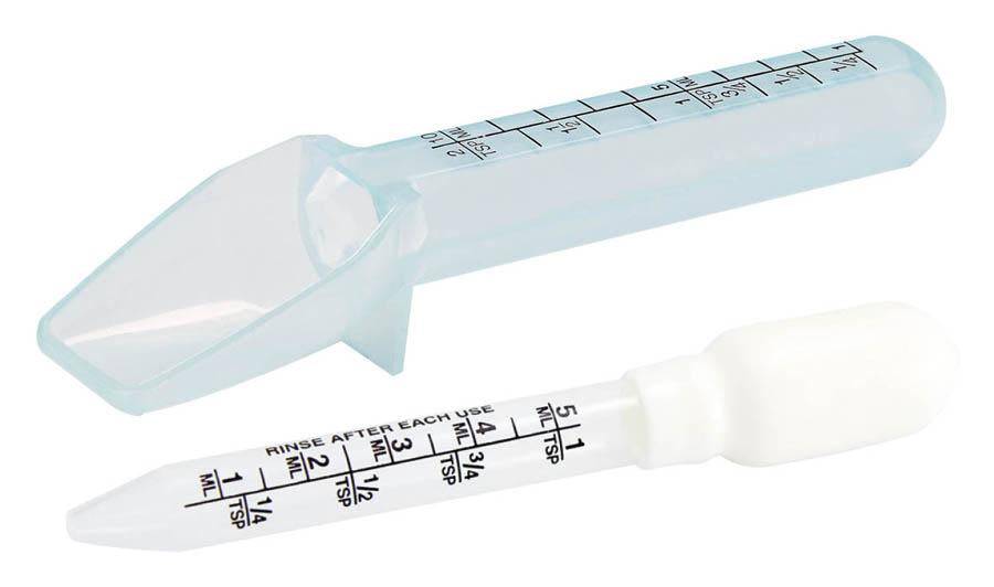 A clear plastic medicine dropper and dosing spoon with measurement markings in milliliters and teaspoons ensures precise administration of liquid medications, much like the meticulous measurements required in the gummy manufacturing process.