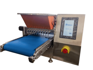 A stainless steel industrial machine with a touchscreen display and a blue conveyor belt. It has multiple nozzles and an emergency stop button. The display shows a brand logo and model information.