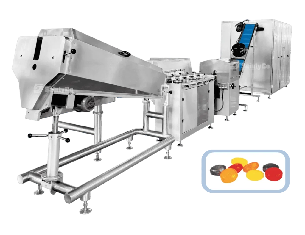 Commercial candy production machine made of stainless steel, featuring a conveyor belt and various processing units. Inset shows colorful hard candies, including red, yellow, orange, and black pieces.